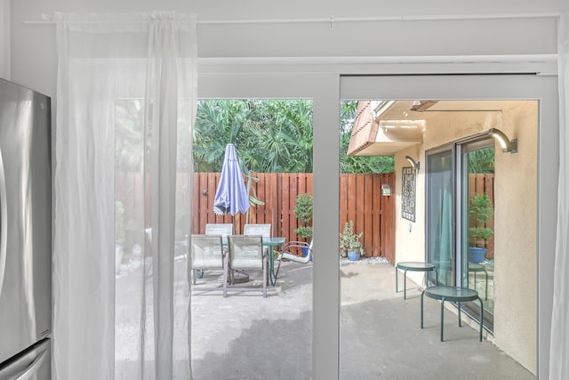 doorway to outside featuring concrete floors