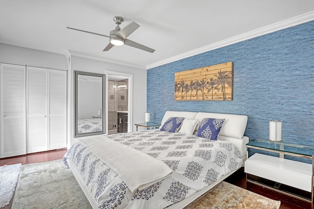 bedroom featuring connected bathroom, ceiling fan, crown molding, hardwood / wood-style floors, and a closet