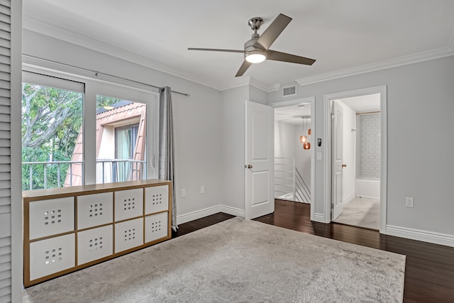 unfurnished bedroom with dark hardwood / wood-style floors, ceiling fan, crown molding, and ensuite bath