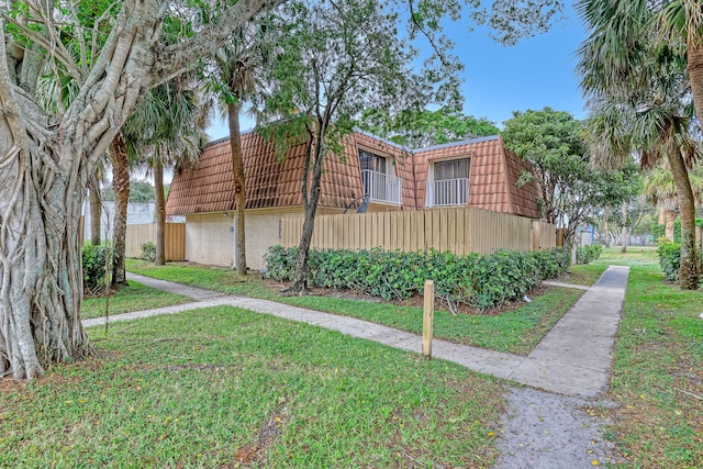 view of home's exterior featuring a yard