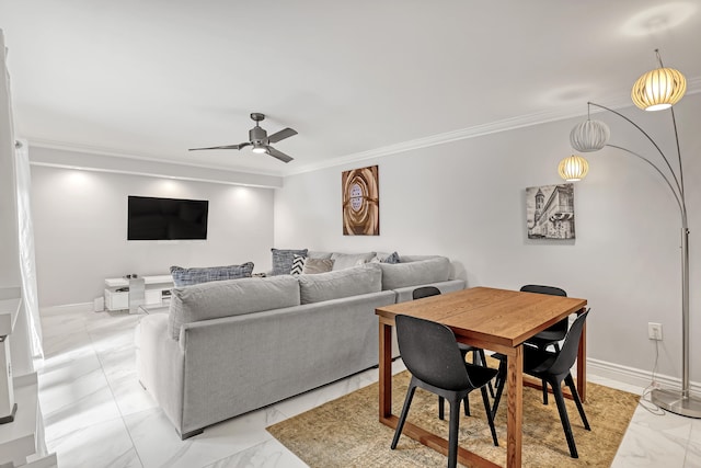 living room featuring ceiling fan and ornamental molding