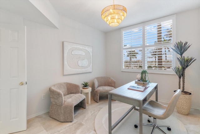 home office featuring baseboards and an inviting chandelier