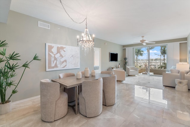 dining area featuring visible vents, baseboards, and ceiling fan with notable chandelier