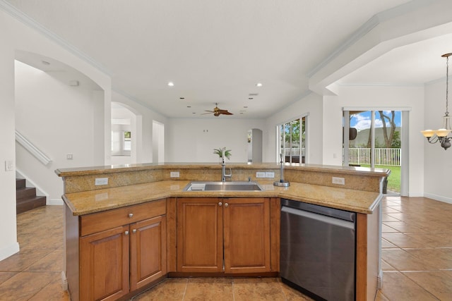 kitchen with pendant lighting, dishwasher, sink, and an island with sink