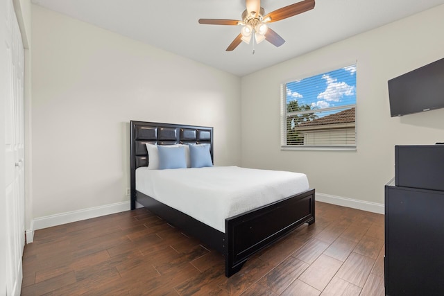 bedroom featuring ceiling fan and dark hardwood / wood-style floors