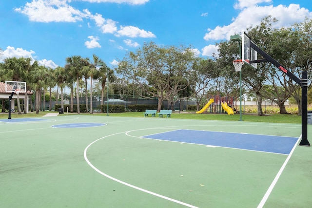 view of basketball court with a playground