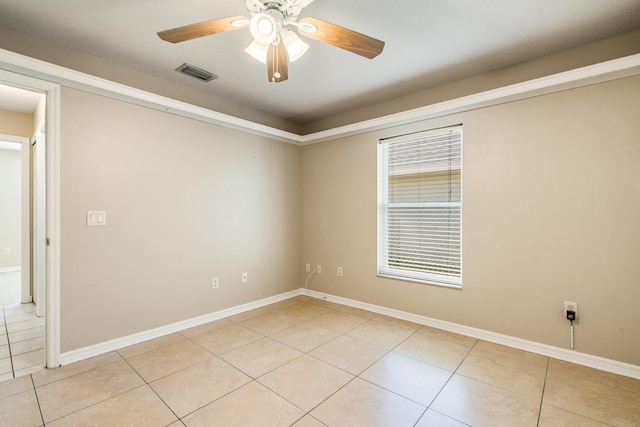 unfurnished room featuring ceiling fan and light tile patterned flooring