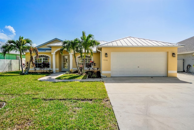 ranch-style home with a front yard and a garage