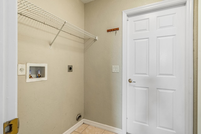 laundry room with hookup for an electric dryer, hookup for a washing machine, and light tile patterned flooring