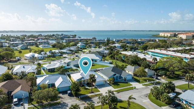 drone / aerial view with a water view