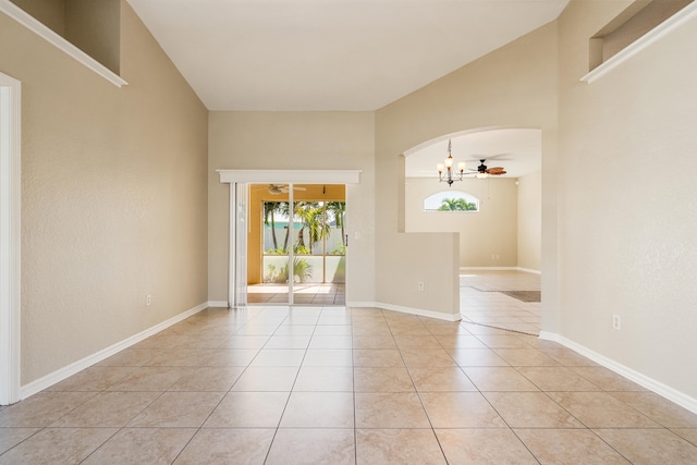 unfurnished room with ceiling fan and light tile patterned floors