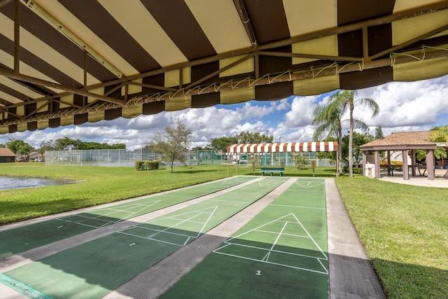 view of home's community featuring a gazebo, a yard, and a water view