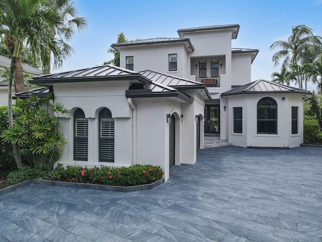 view of front of property with a balcony