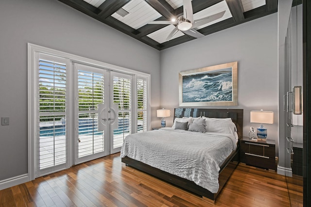 bedroom with access to exterior, ceiling fan, beamed ceiling, and wood-type flooring