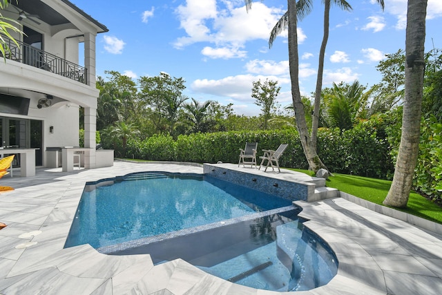 view of swimming pool featuring area for grilling, an in ground hot tub, and a patio