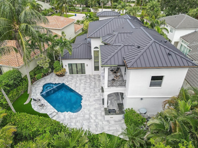 back of house with a patio