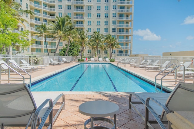 view of swimming pool with a patio area