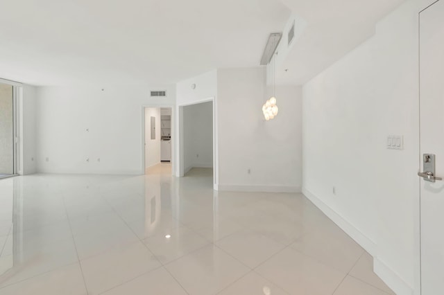 unfurnished room featuring light tile patterned flooring