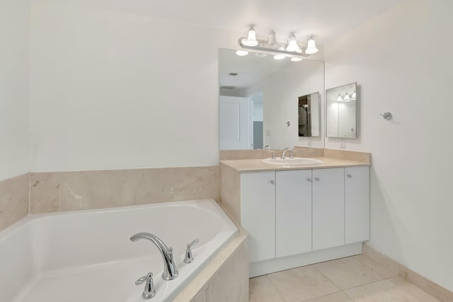 bathroom featuring vanity, tiled bath, and tile patterned flooring