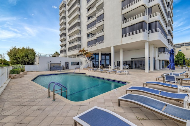 view of swimming pool featuring a patio area