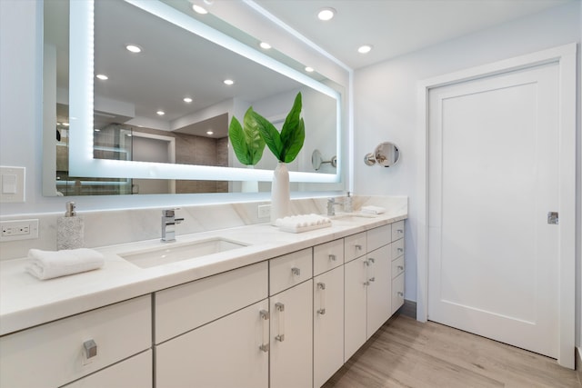 bathroom featuring hardwood / wood-style floors and vanity