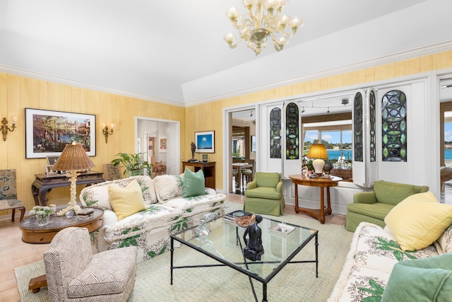 living room featuring a notable chandelier and crown molding