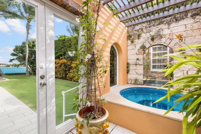 view of swimming pool featuring a water view