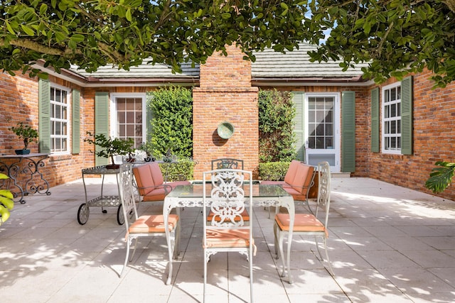 view of patio / terrace featuring a fireplace