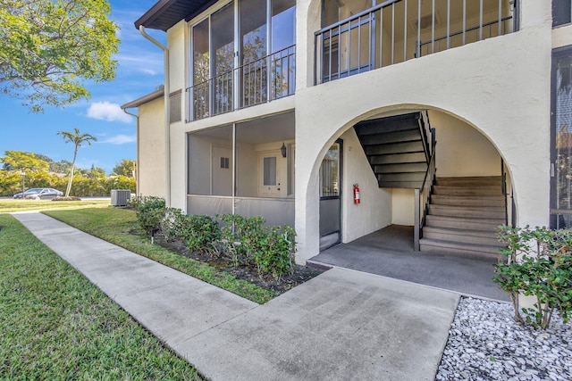 entrance to property featuring central AC