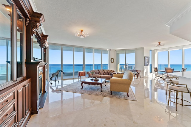 living room featuring a textured ceiling, floor to ceiling windows, a healthy amount of sunlight, and a water view