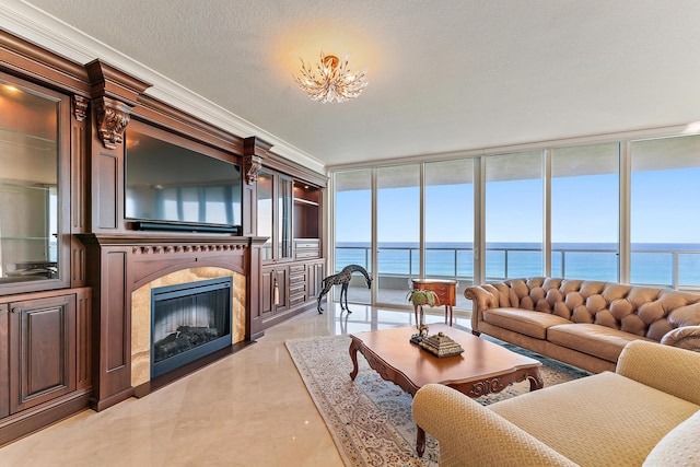 living room with expansive windows, ornamental molding, and a textured ceiling