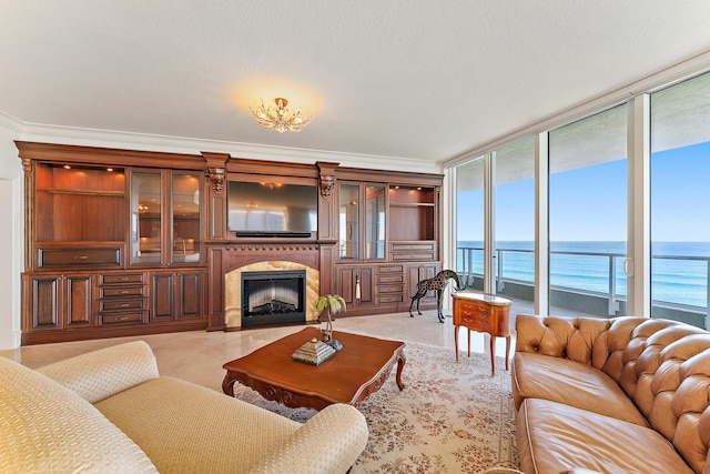 tiled living room featuring expansive windows and crown molding