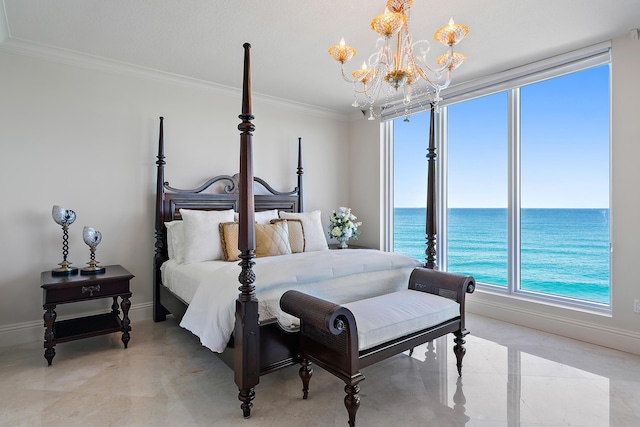 bedroom featuring ornamental molding, a water view, and an inviting chandelier