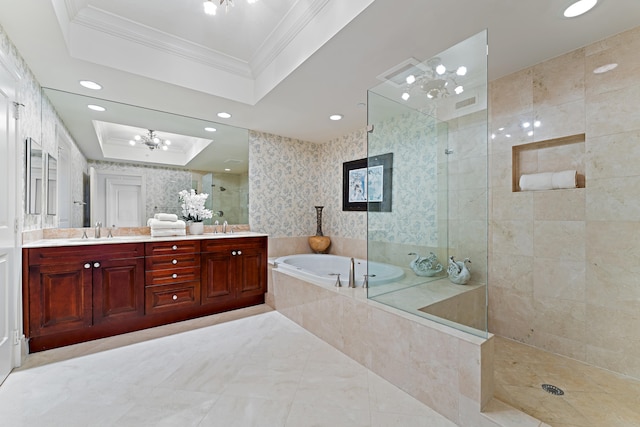 bathroom featuring plus walk in shower, ornamental molding, vanity, a notable chandelier, and a raised ceiling