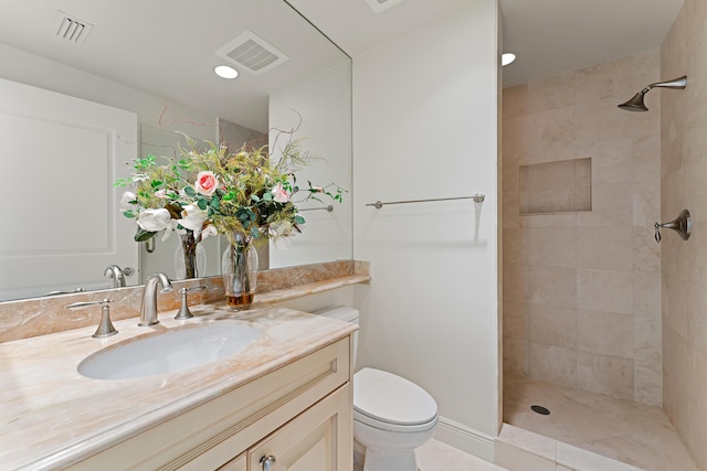 5050 N Ocean Dr Unit 702, Singer Island, FL 33404 - bathroom with vanity, toilet, a tile shower, and recessed lighting