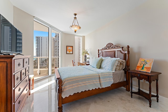 bedroom with expansive windows and light tile patterned flooring