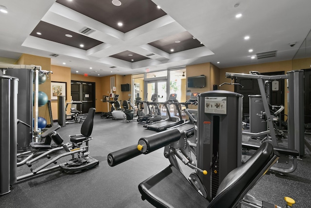 gym featuring coffered ceiling