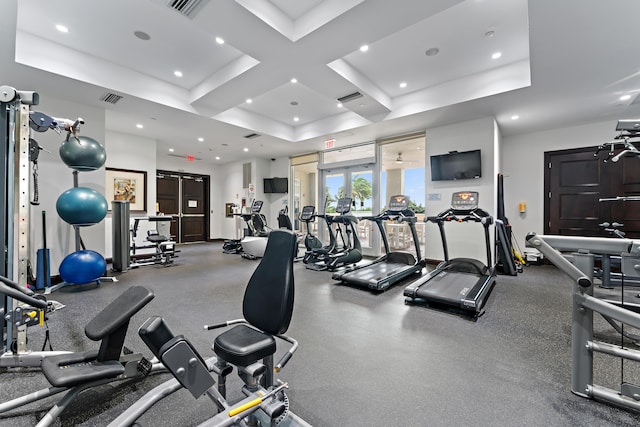 exercise room featuring french doors and coffered ceiling