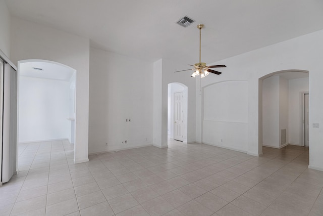 spare room featuring light tile patterned floors and ceiling fan