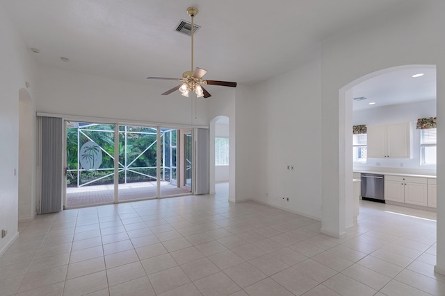 empty room with light tile patterned floors and ceiling fan