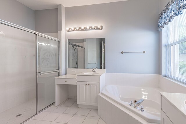 bathroom with vanity, shower with separate bathtub, and tile patterned flooring