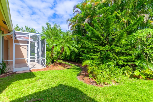 view of yard featuring a lanai