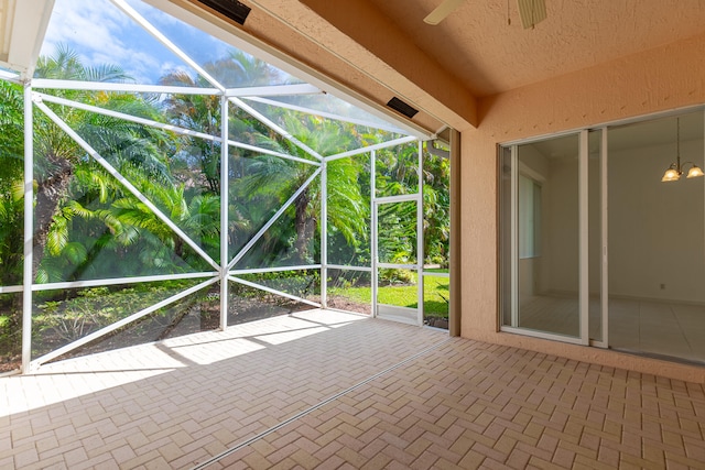 view of patio / terrace featuring a lanai