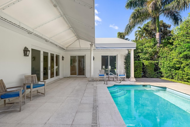 view of pool with a patio area and french doors