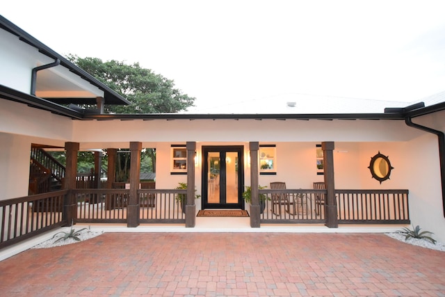 doorway to property featuring a porch