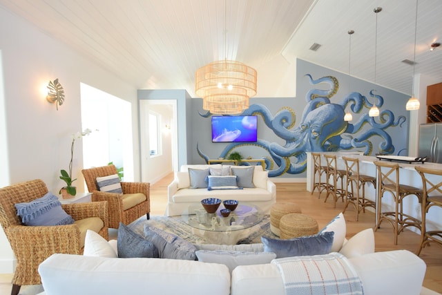 living room featuring wood ceiling, a chandelier, lofted ceiling, and light wood-type flooring