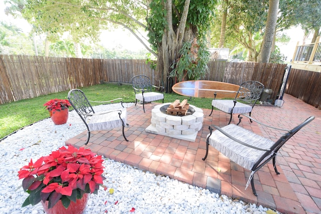 view of patio / terrace with an outdoor fire pit