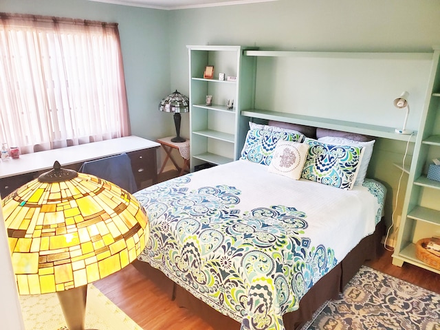 bedroom featuring hardwood / wood-style flooring