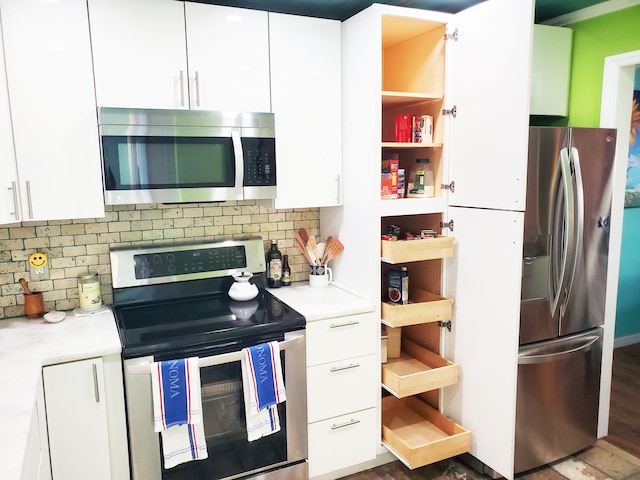 kitchen with white cabinets, stainless steel appliances, tasteful backsplash, and dark hardwood / wood-style floors