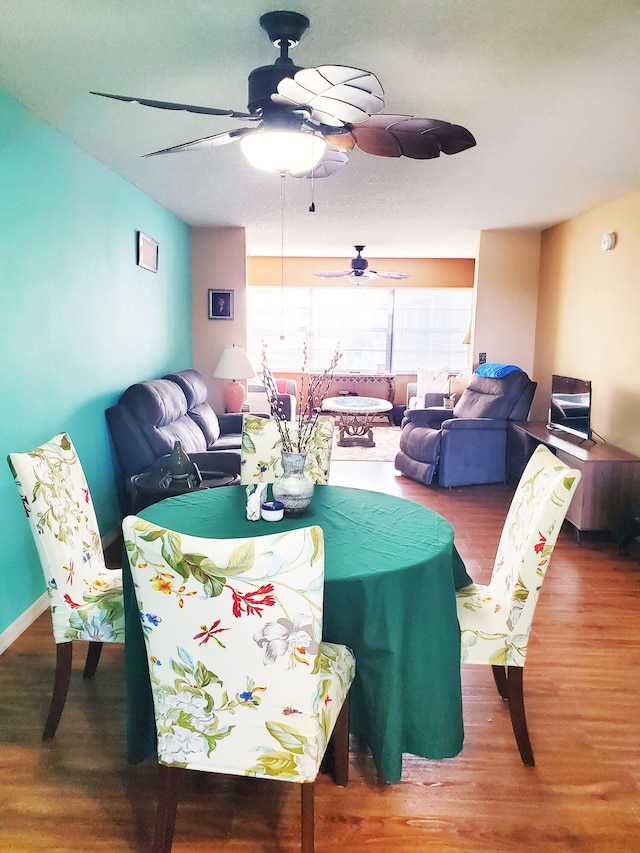 dining space with hardwood / wood-style flooring